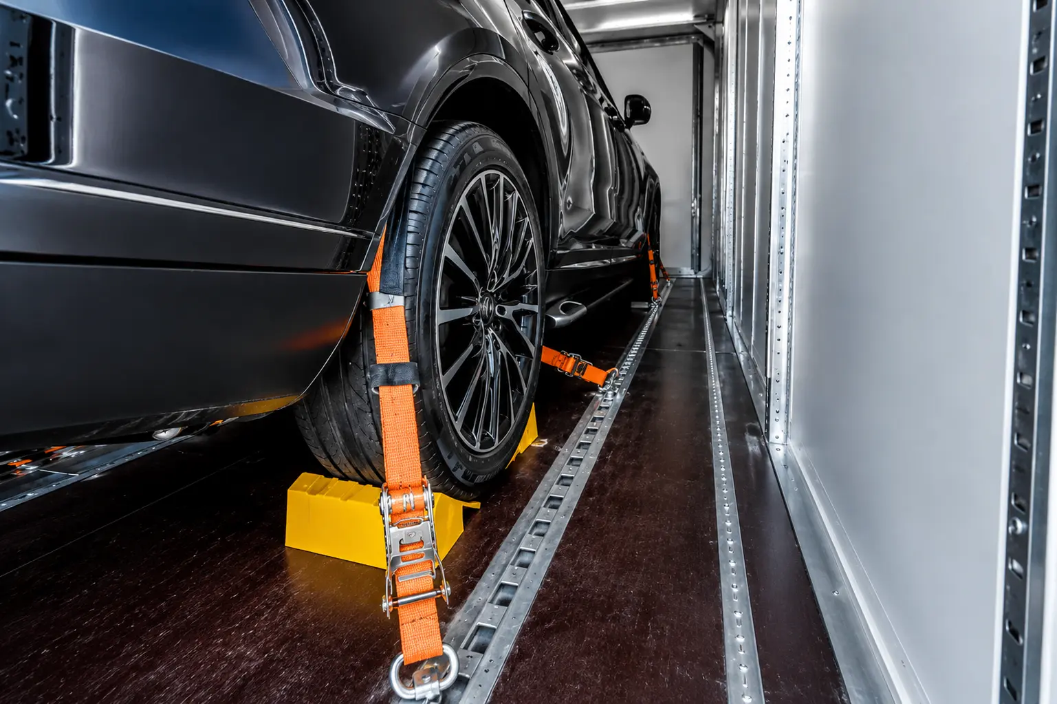 Enclosed car shipping wheel tie down secure loading
